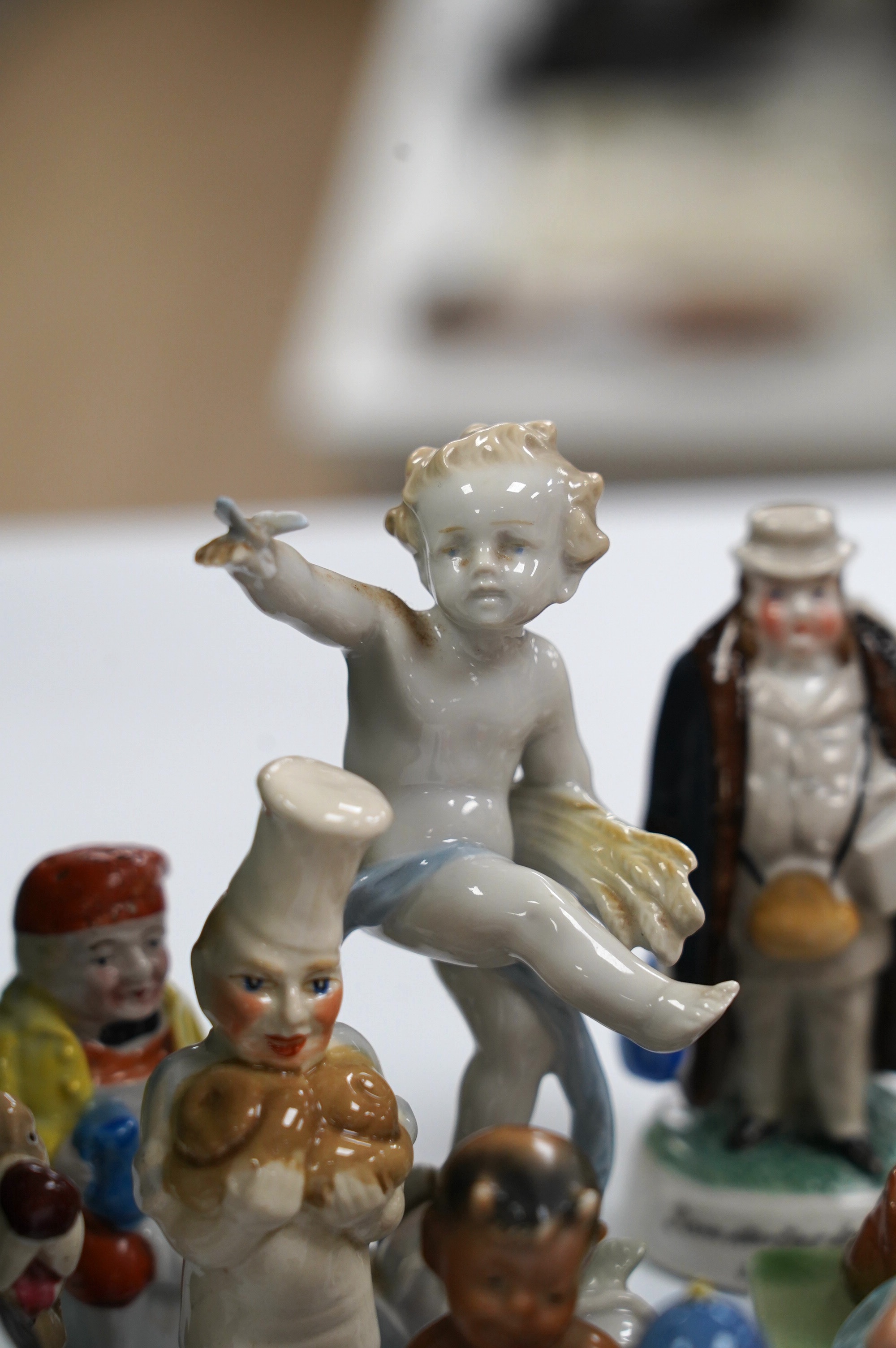 A box of small figures including Wade ceramics, Metzler & Ortloff, etc. highest 12.5cm (14). Condition - fair to good